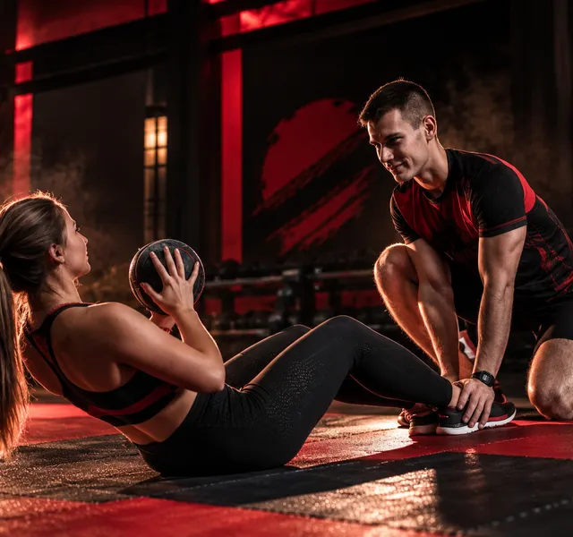 A woman training with weights in a gym